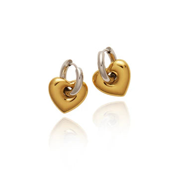 Pair of gold heart-shaped earrings on a white background