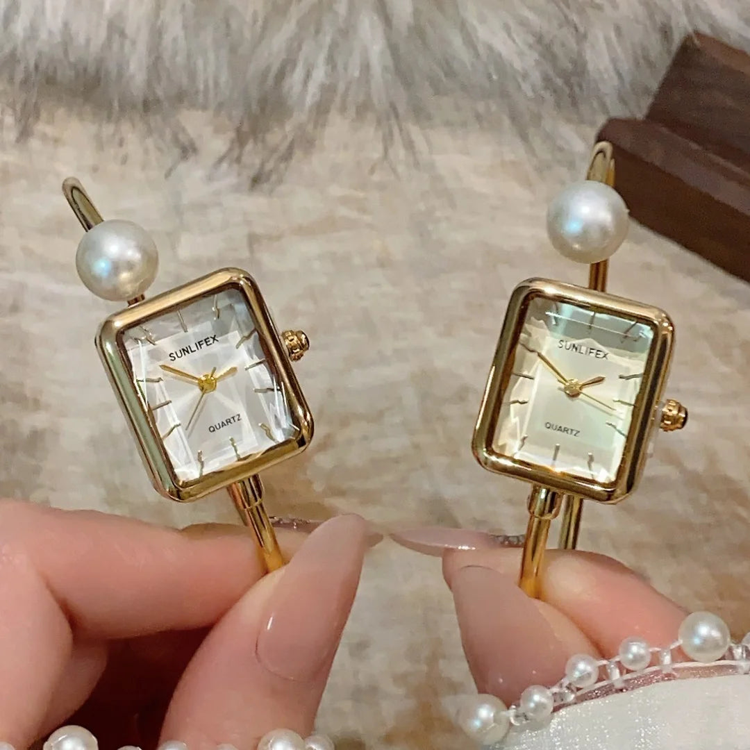 Golden Watch with pearl and white dial