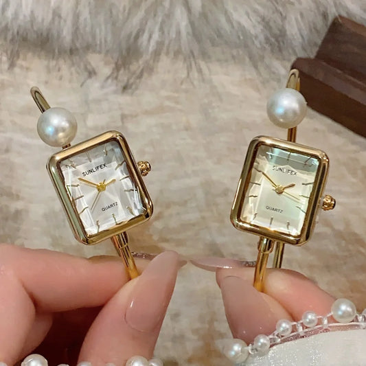 Golden Watch with pearl and white dial